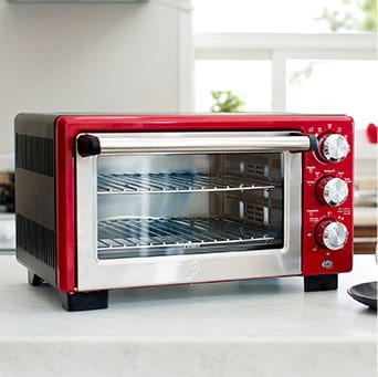 Horno eléctrico rojo con perillas del lado derecho. Pulsa aquí para comprar el tuyo, abre en pestaña nueva. 